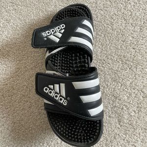 Black and white adidas slides